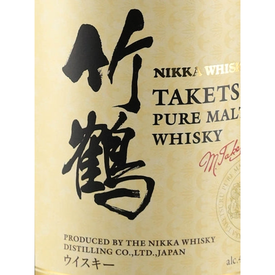 Close-up of Japanese Taketsuru calligraphy on the cream whisky bottle label