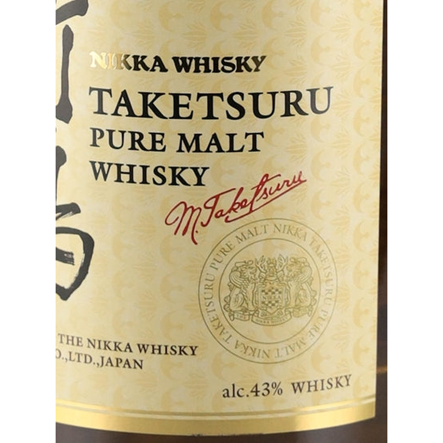 Taketsuru Pure Malt label detail with Masataka Taketsuru signature, crest and 43% ABV