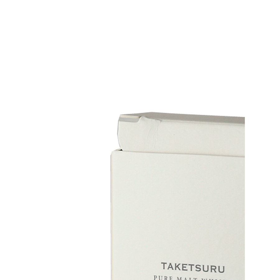 Top corner of Taketsuru Pure Malt presentation box with a visible crease on the flap