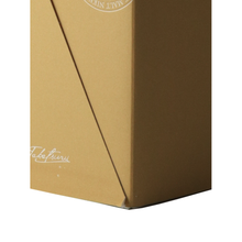 Load image into Gallery viewer, Lower corner of Taketsuru Pure Malt gold presentation box showing slight edge wear