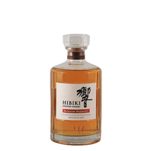 Load image into Gallery viewer, Full front view of Hibiki Blossom Harmony 2023 bottle with amber whisky against a white background