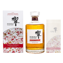 Hibiki Blossom Harmony 2021 whisky bottle with floral presentation box and matching booklet on a white background