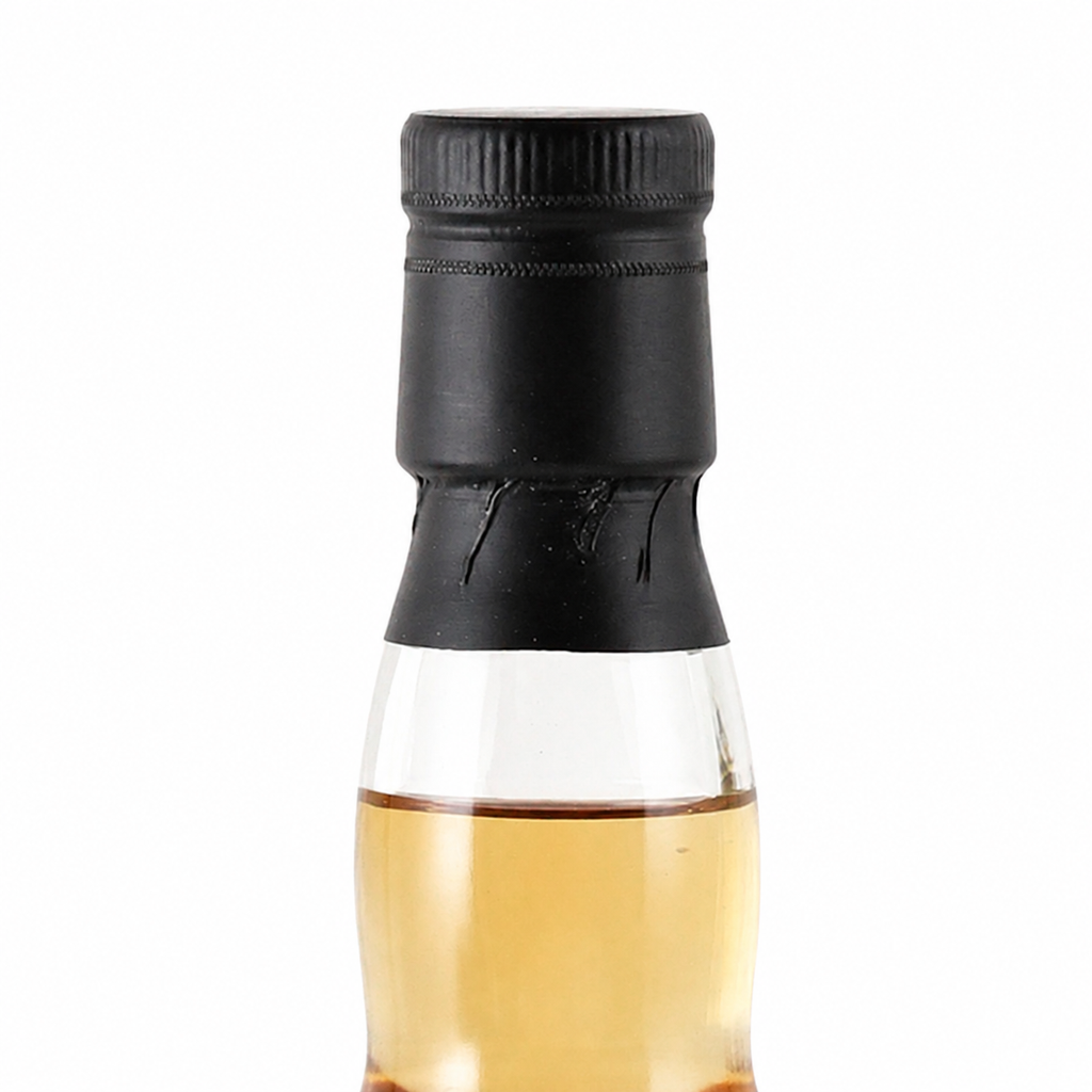 Close-up of the black cap, neck seal and whisky fill level on the Ardmore bottle