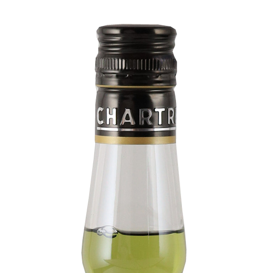 Chartreuse Green herbal liqueur, black cap and clear glass neck