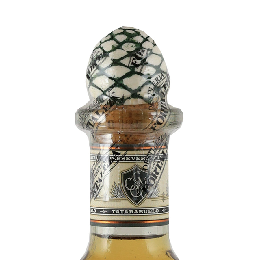 Fortaleza Anejo tequila, agave-shaped stopper and neck label