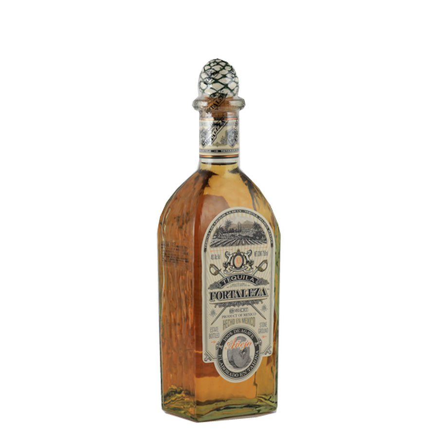 Fortaleza Anejo tequila, bottle viewed from the left