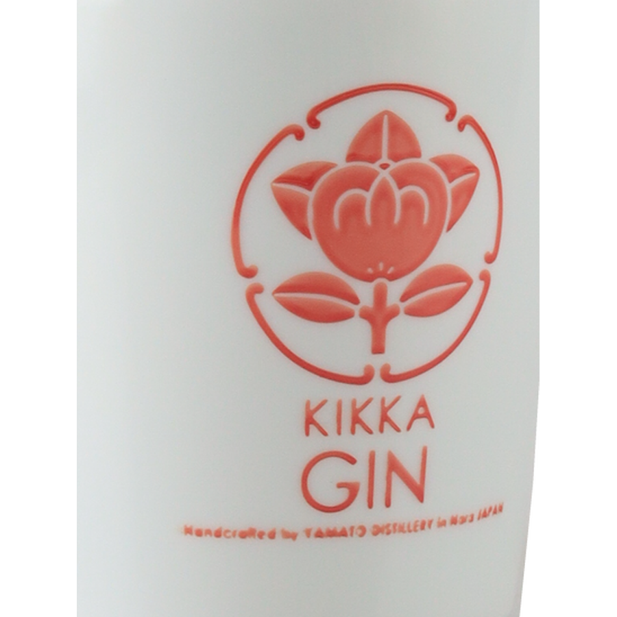 Kikka Gin Red Hanezu emblem and lettering on the white bottle, angled close-up