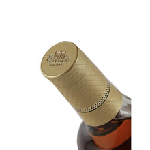 Load image into Gallery viewer, The Macallan 12 Year Old Double Cask whisky, angled gold cap with embossed distillery emblem
