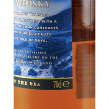 Load image into Gallery viewer, Talisker Skye single malt Scotch whisky label close-up showing the 70cl volume marking and Made by the Sea text