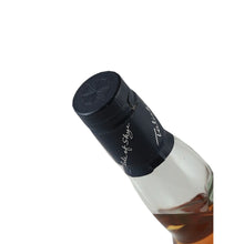 Load image into Gallery viewer, Talisker Storm single malt Scotch whisky angled detail of the black cap with compass emblem